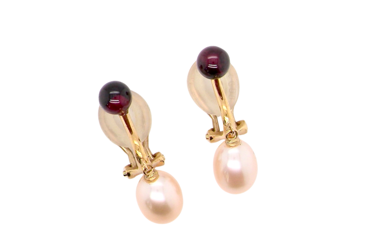 A pair of pearl and garnet earrings