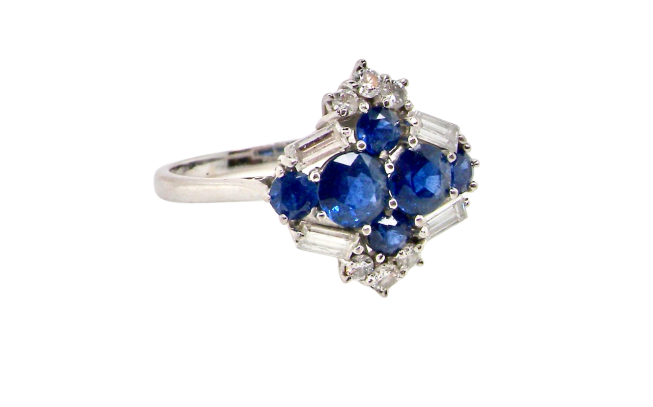 An 18 carat white gold sapphire and diamond cluster ring
