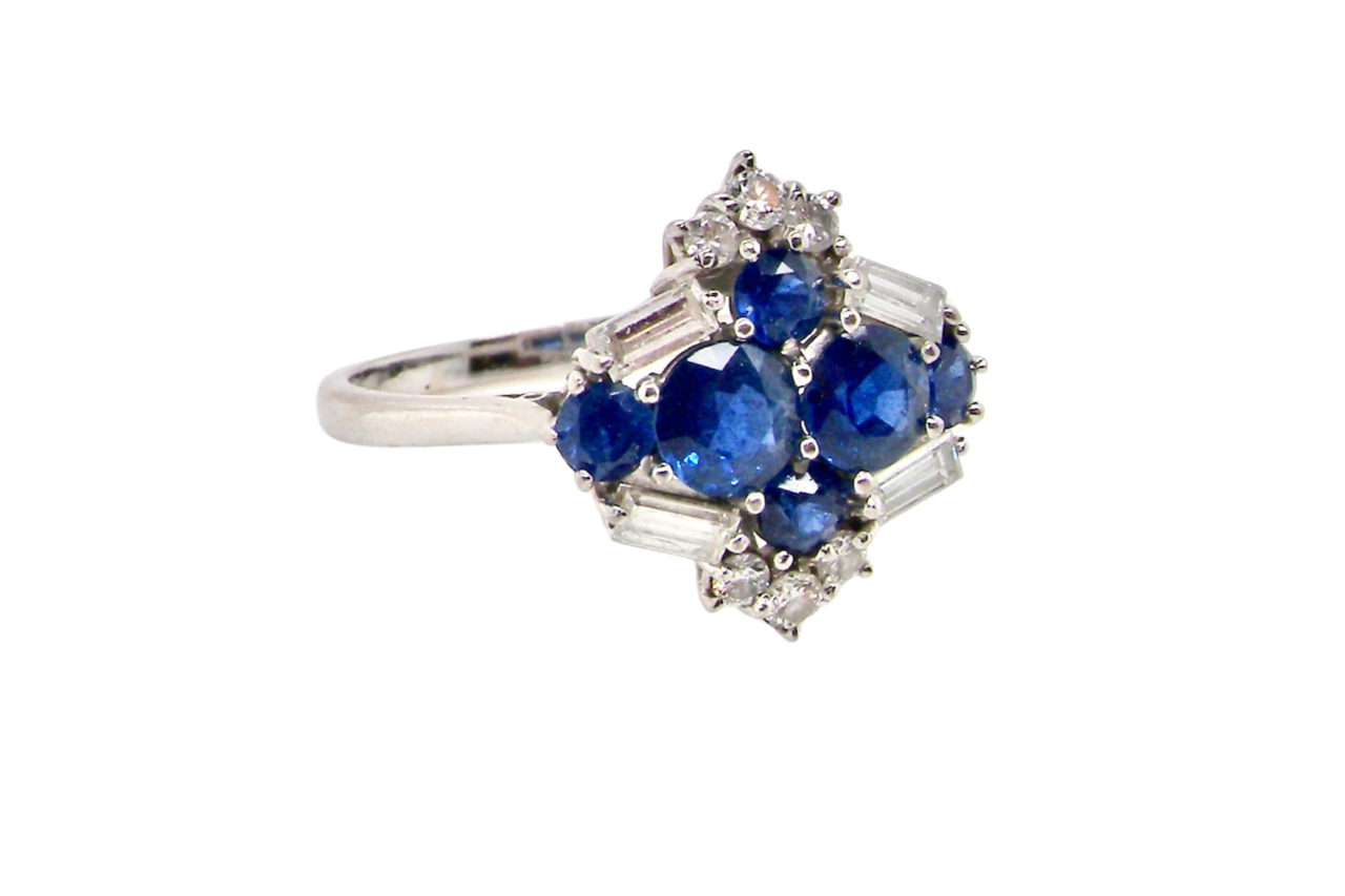 An 18 carat white gold sapphire and diamond cluster ring