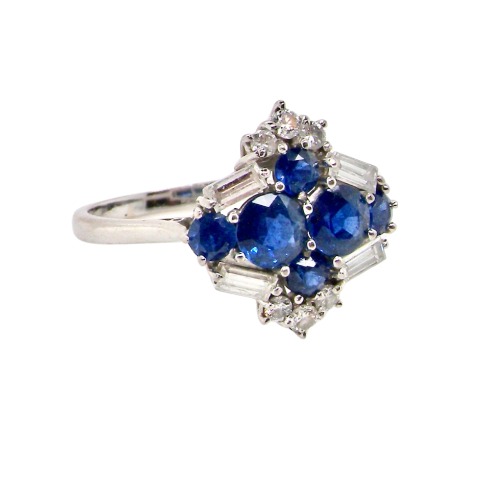 An 18 carat white gold sapphire and diamond cluster ring