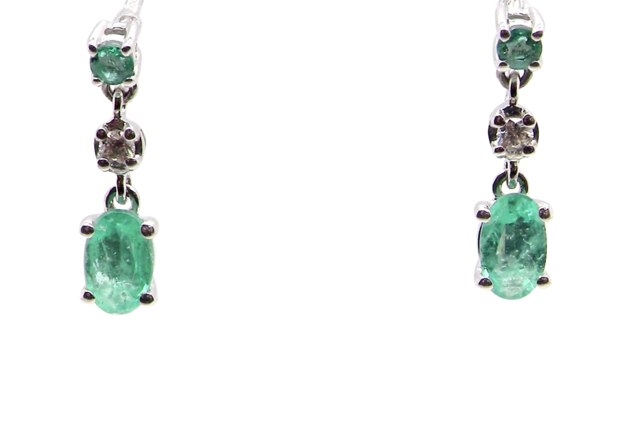 A pair of emerald and diamond earrings