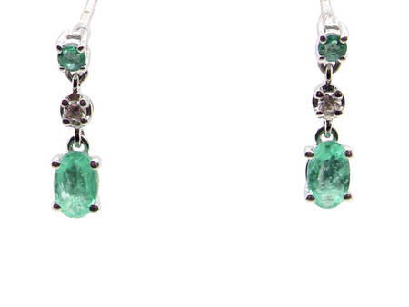 A pair of emerald and diamond earrings