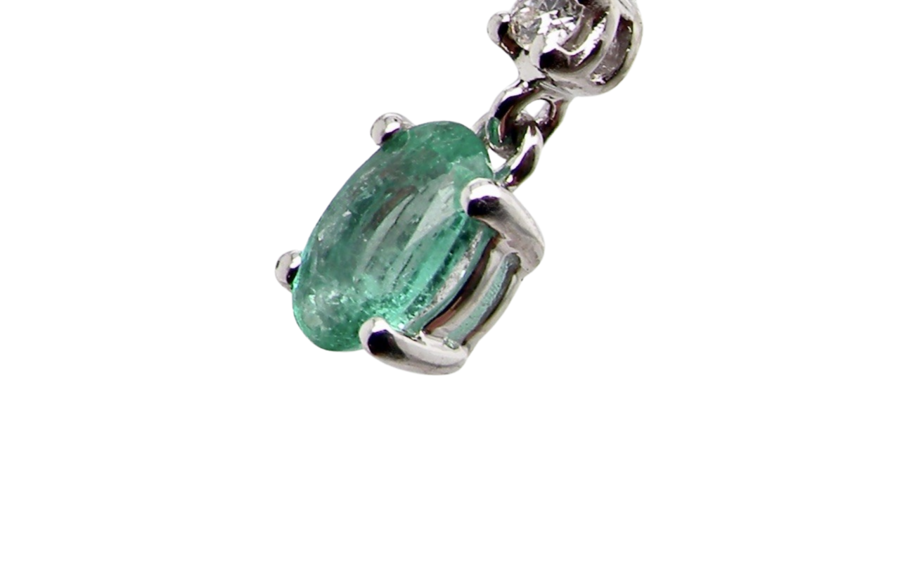 An emerald and diamond earring