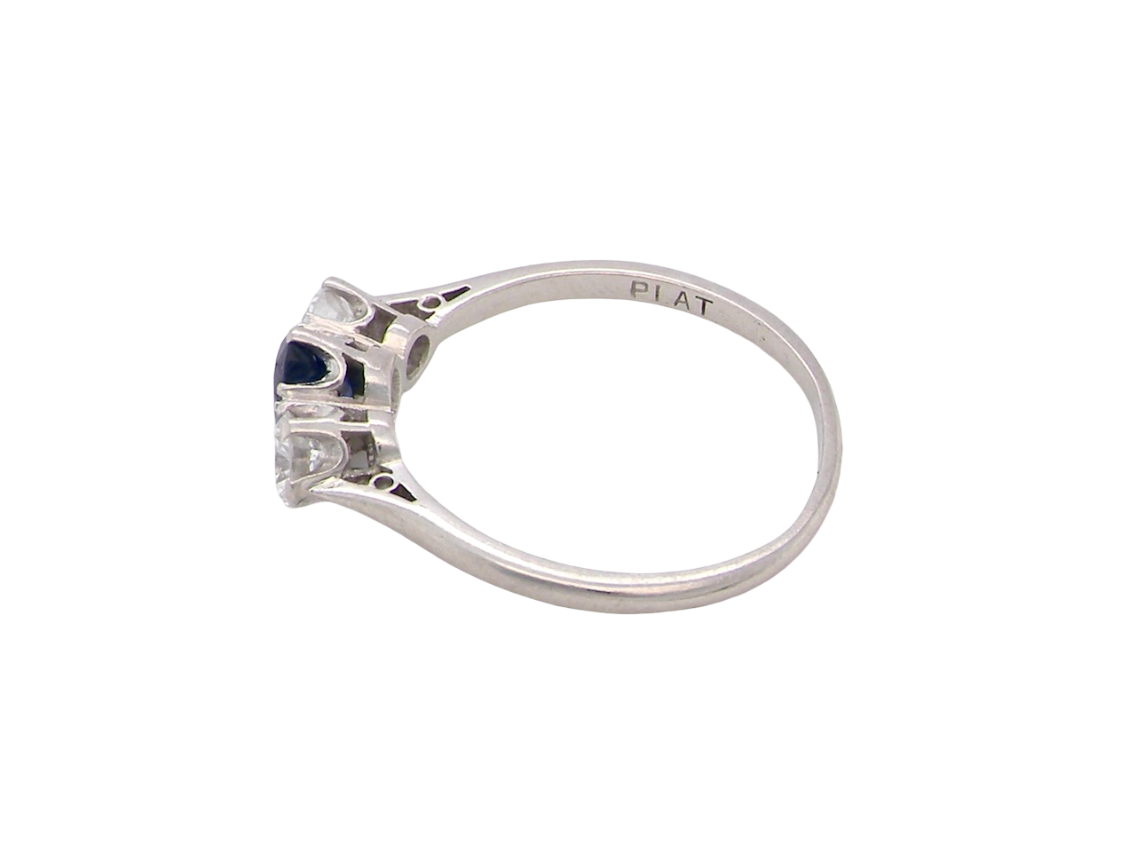 side classic trilogy ring set with an exquisite oval cut sapphire centre stone, hues of deep blue colour and measuring 6x4.2mm (est approx 0.50 carats)