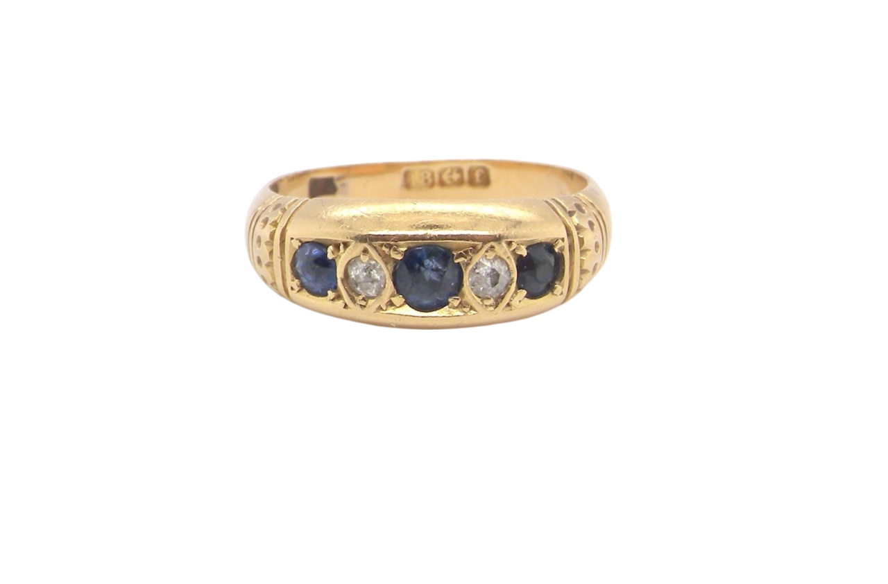 An 18 carat gold sapphire and diamond ring