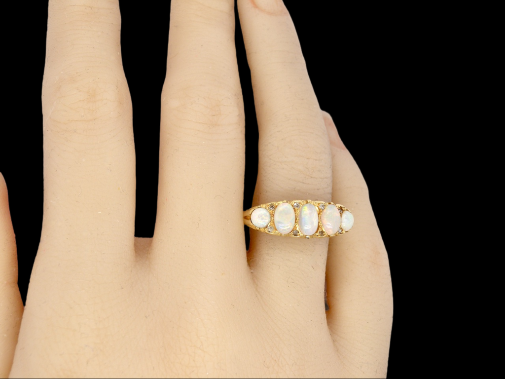 An 18 carat gold 5 stone opal ring