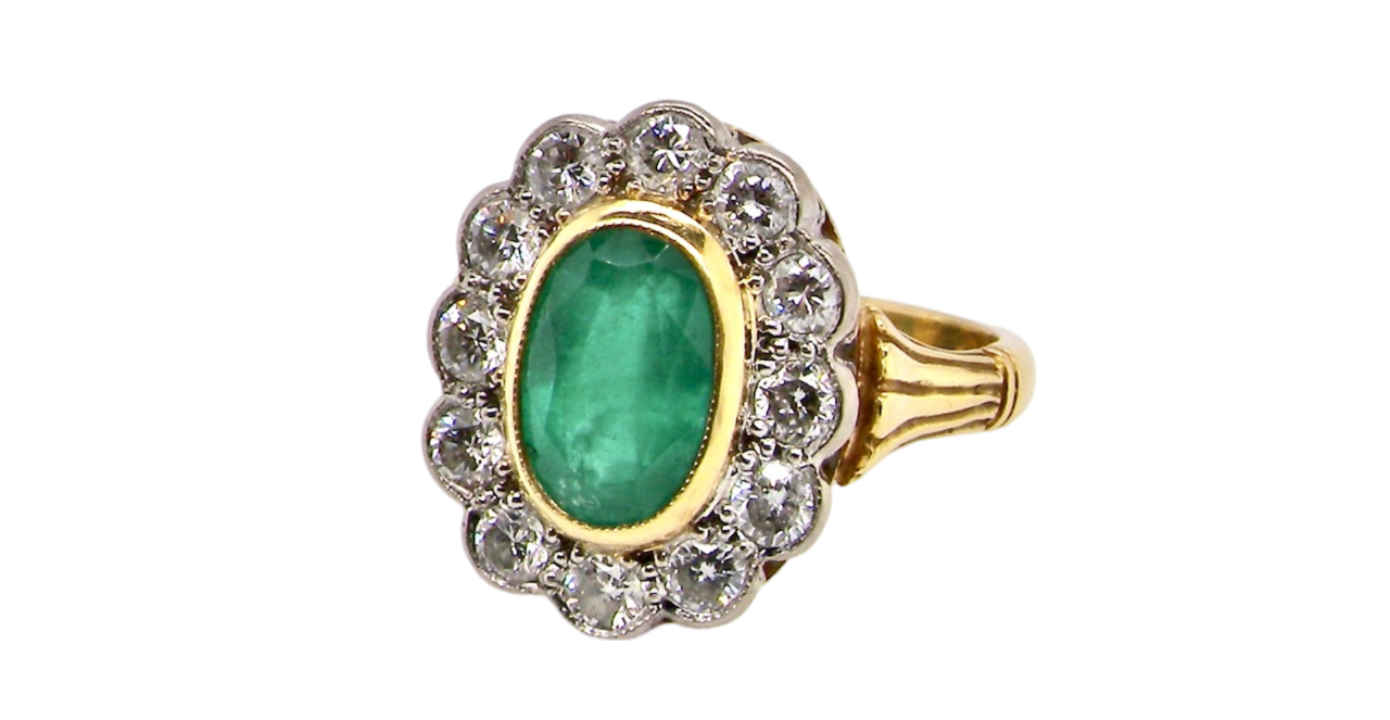 An Emerald and Diamond Ring
