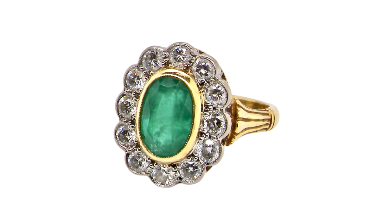 An Emerald and Diamond Ring