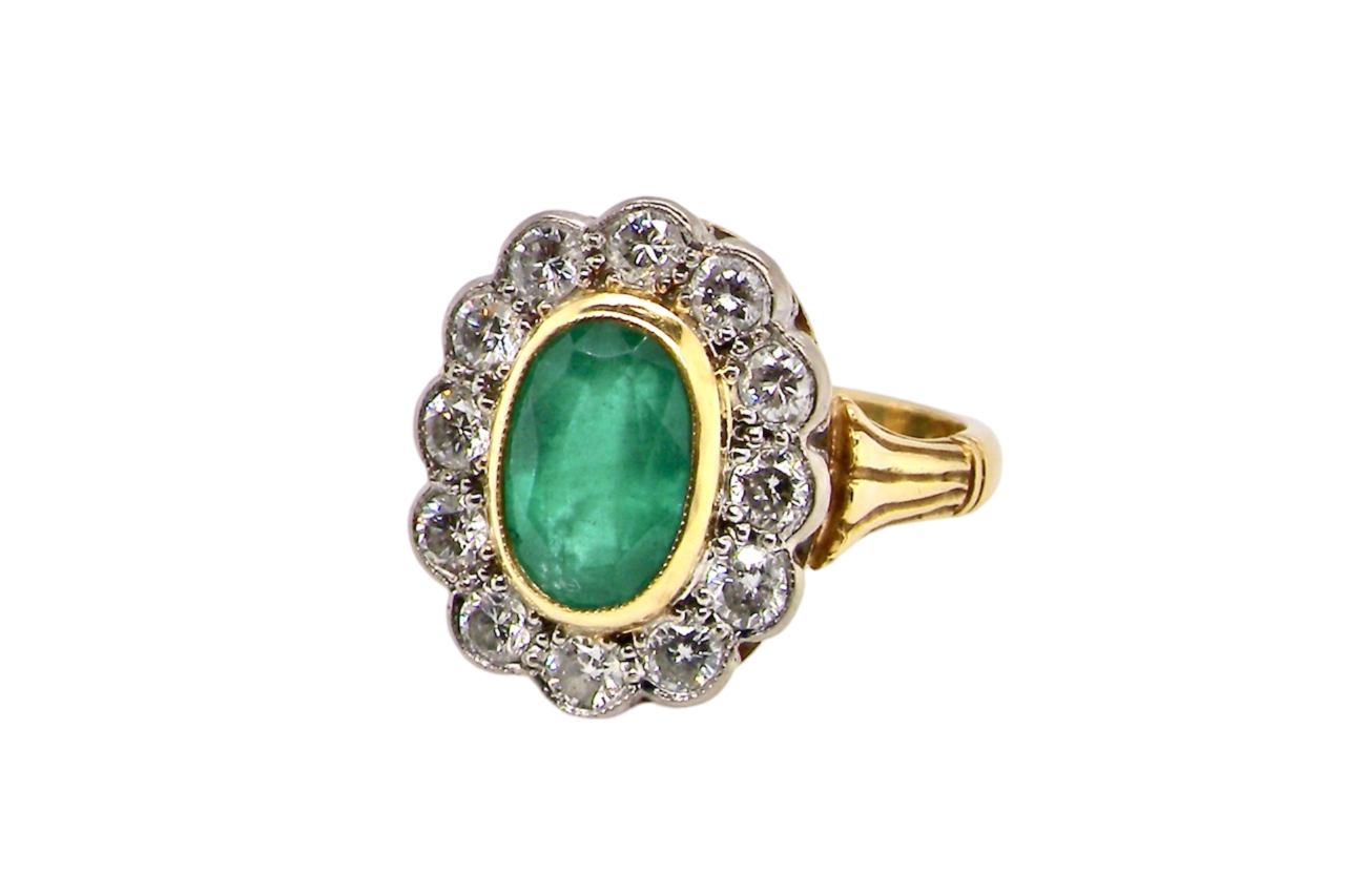 An Emerald and Diamond Ring