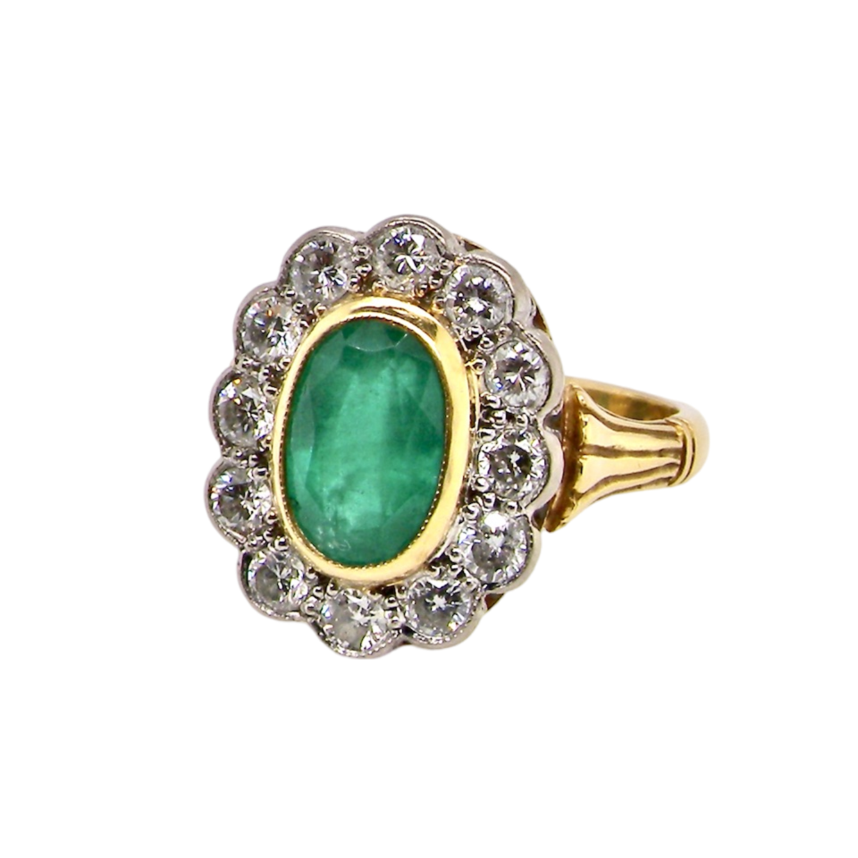 An Emerald and Diamond Ring