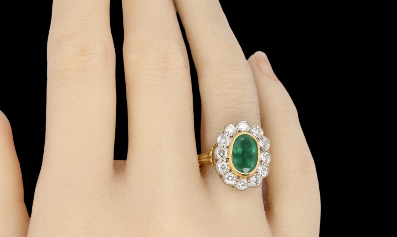 An 18 carat gold Emerald and Diamond Ring