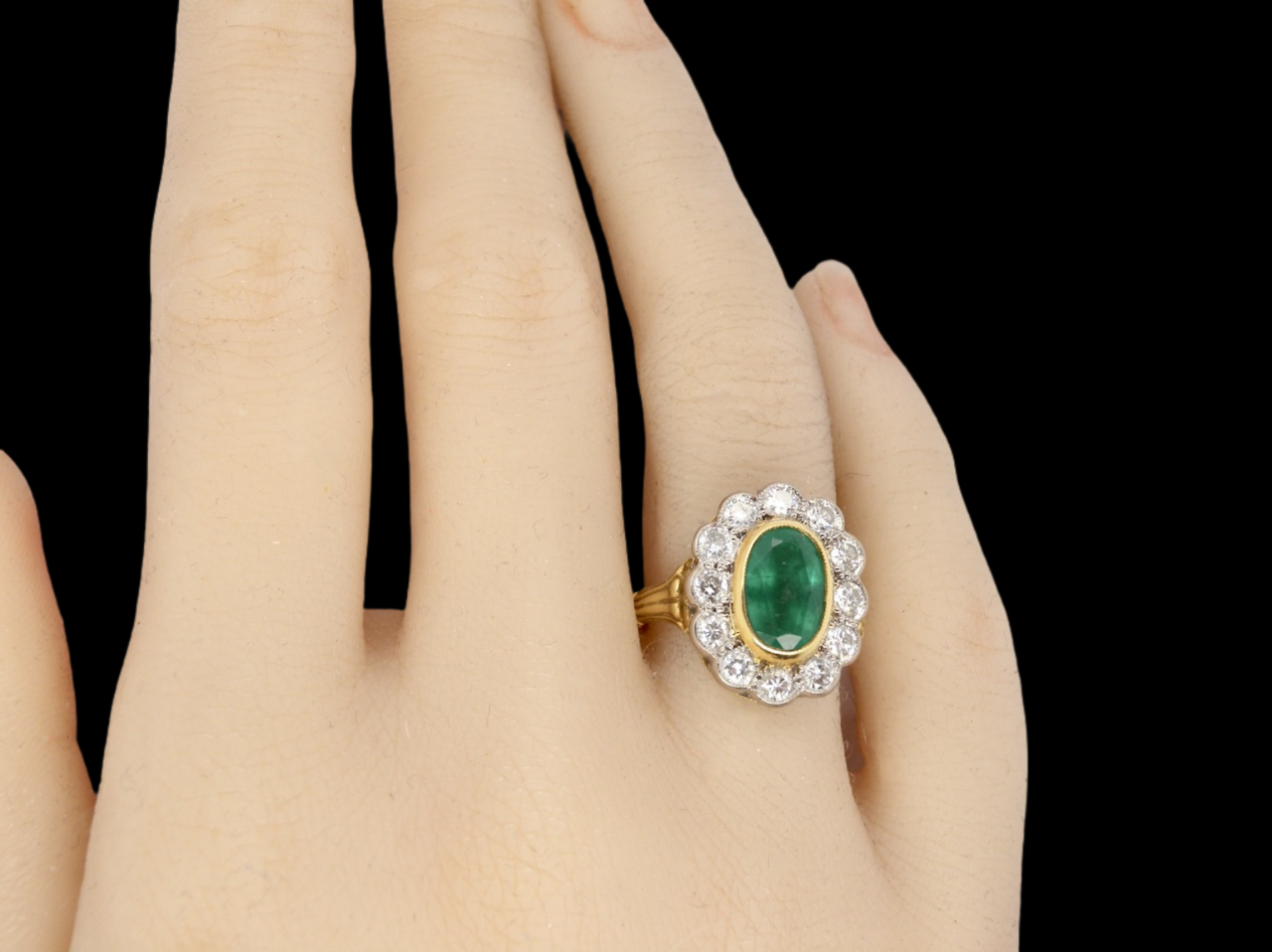 An 18 carat gold Emerald and Diamond Ring