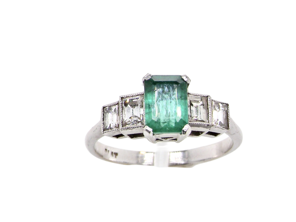 A vintage emerald and diamond ring