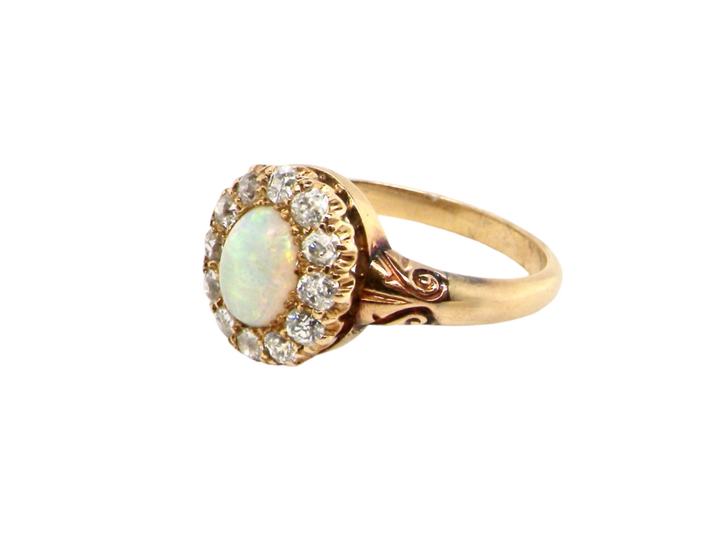 An antique opal and diamond cluster ring