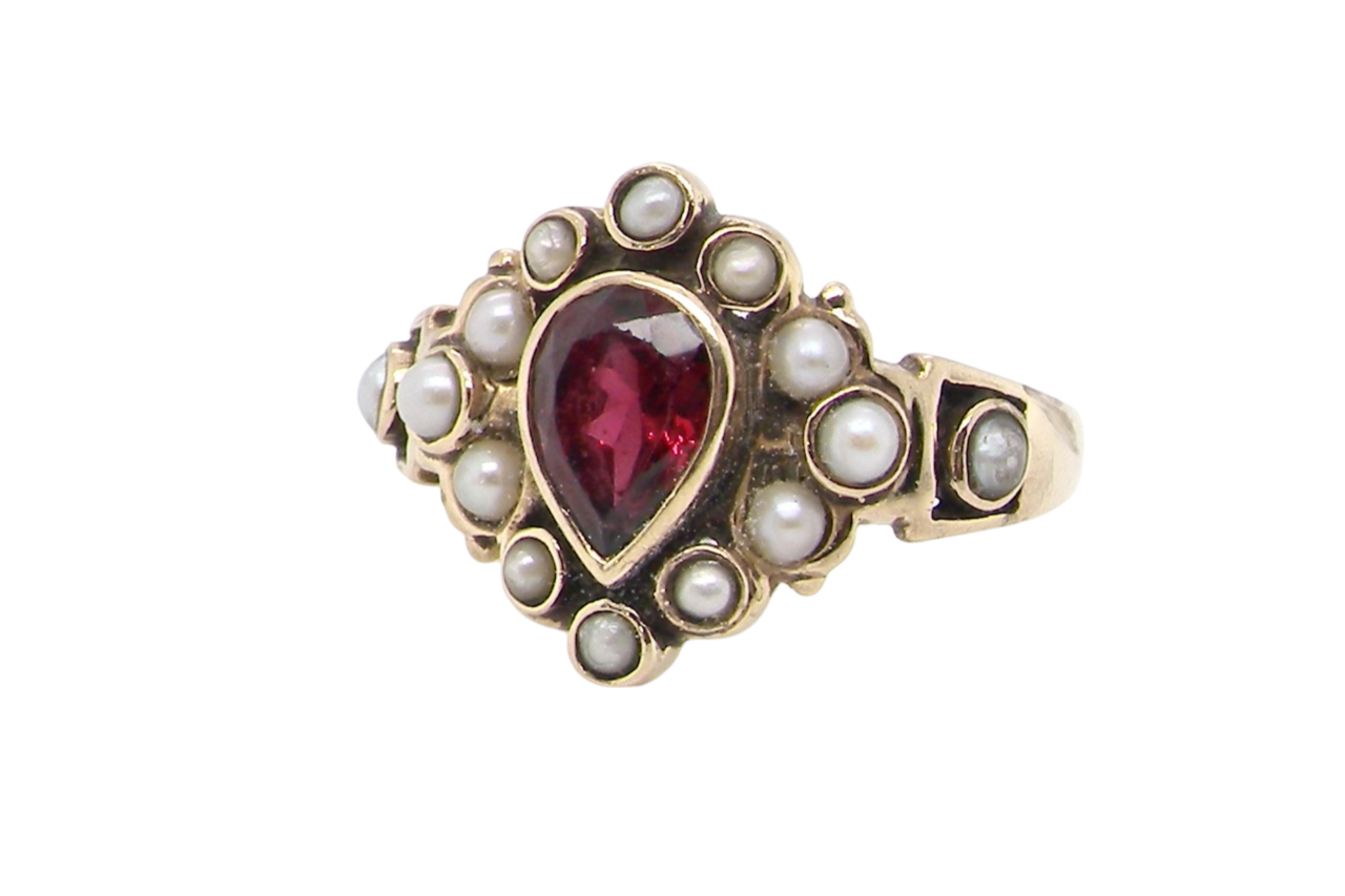 A vintage garnet and pearl dress ring