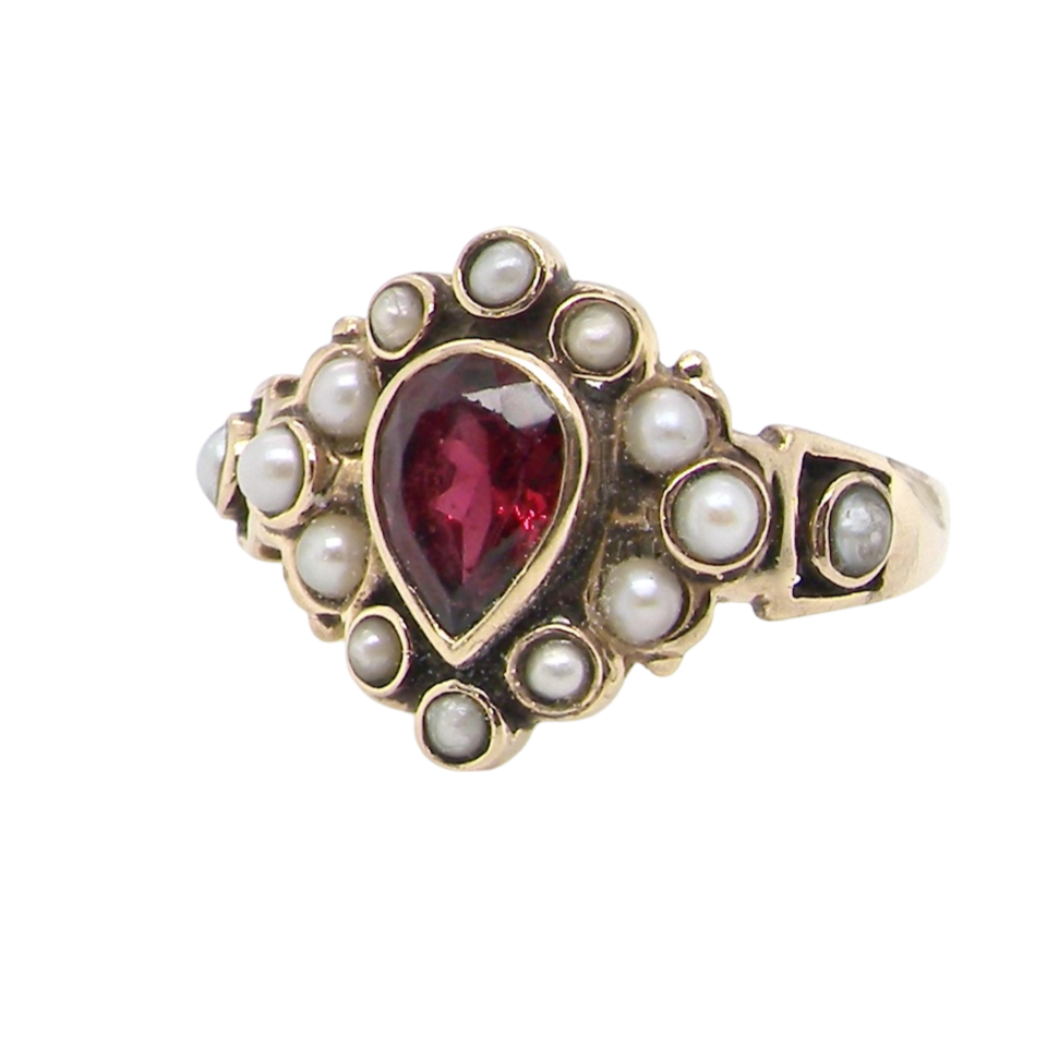 A vintage garnet and pearl dress ring