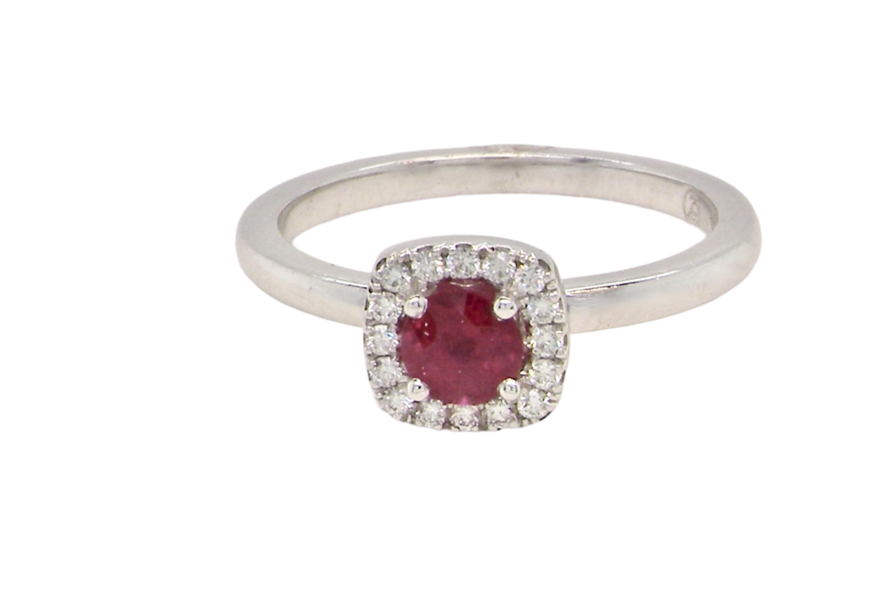 A cushion shaped ruby an d diamond ring