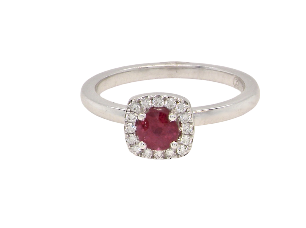 A cushion shaped ruby an d diamond ring