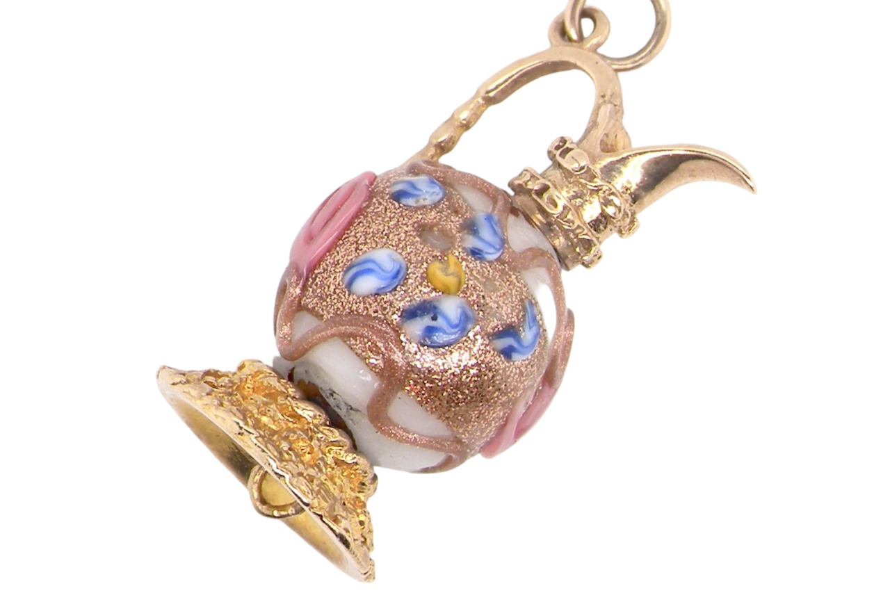A gold jug charm