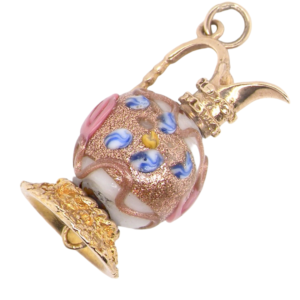 A gold jug charm