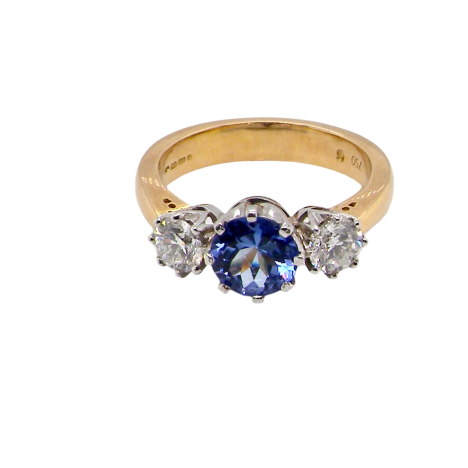 A three stone Tanzanite and Diamond Ring