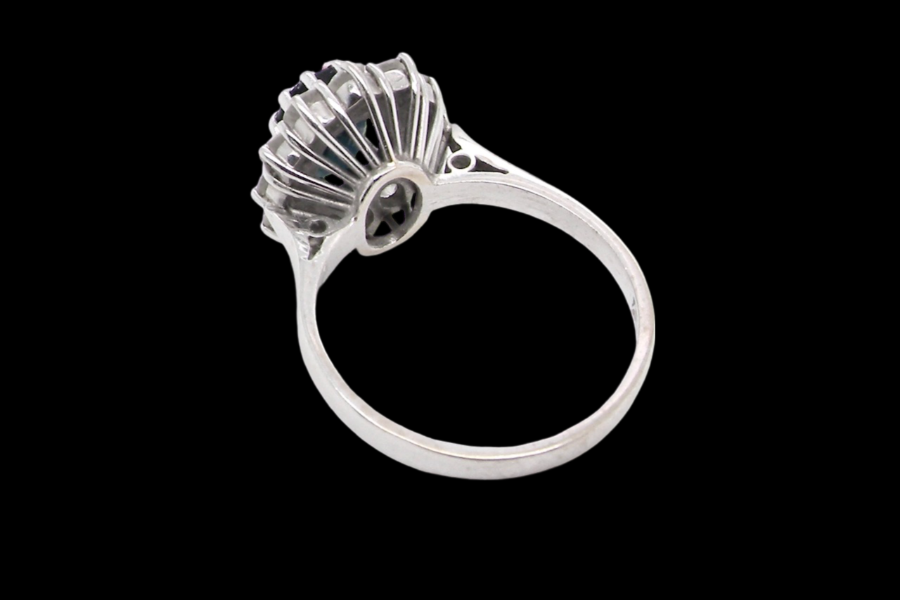 A sapphire and diamond cluster ring rear view
