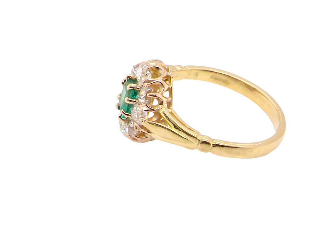 An Emerald and Diamond Cluster Ring side view