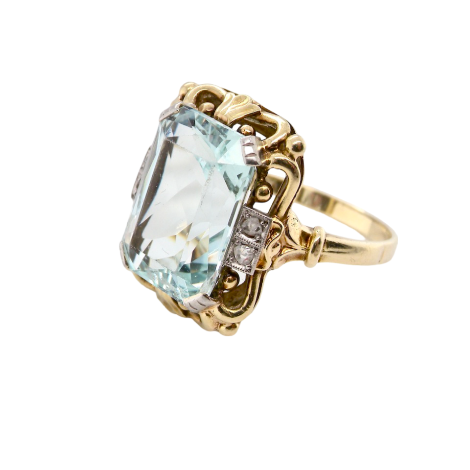 An aquamarine and diamond dress ring