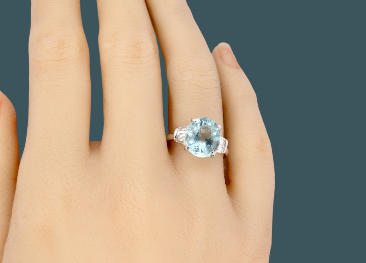 An Aquamarine and Diamond ring finger view