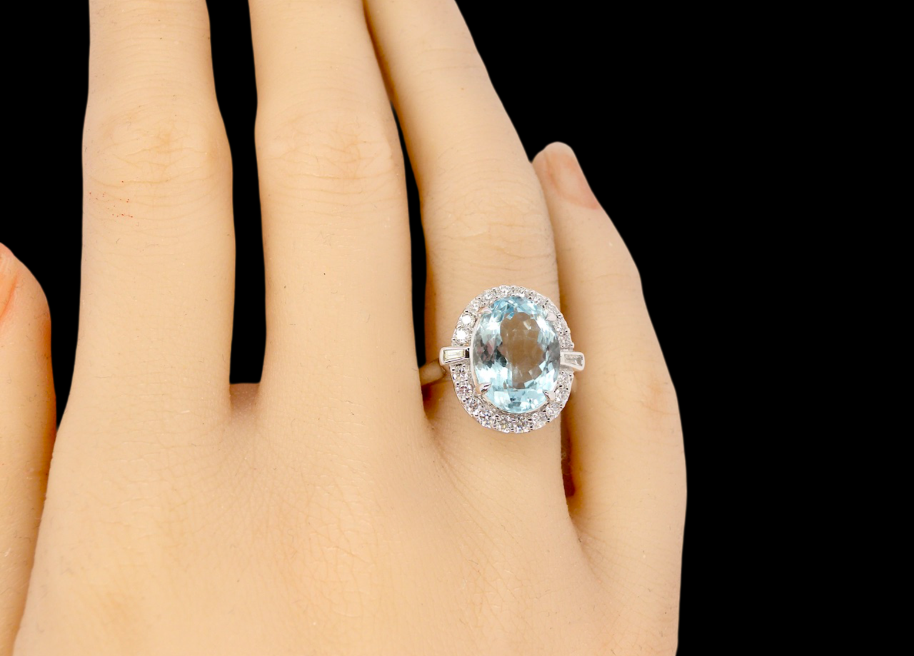 An impressive Aquamarine and Diamond Cluster Ring finger view