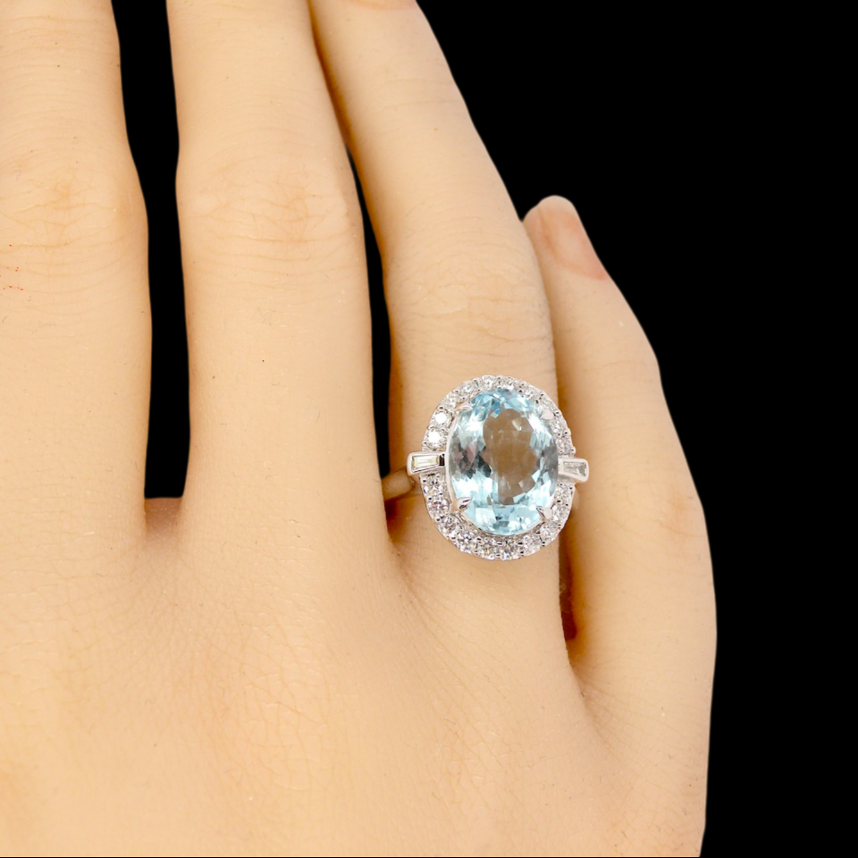 An impressive Aquamarine and Diamond Cluster Ring finger view