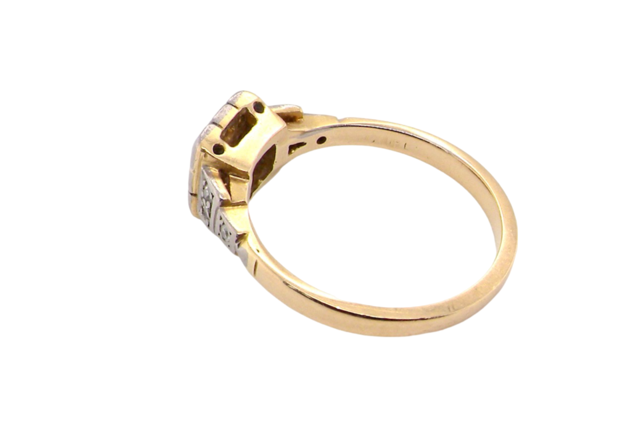 A vintage diamond cluster ring side view