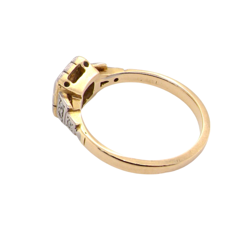 A vintage diamond cluster ring side view