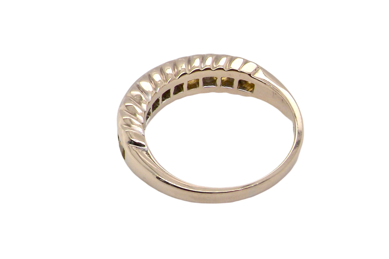 A yellow sapphire and diamond eternity ring rear view