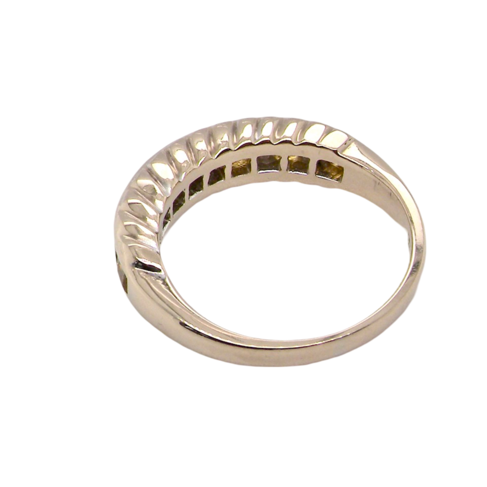 A yellow sapphire and diamond eternity ring rear view