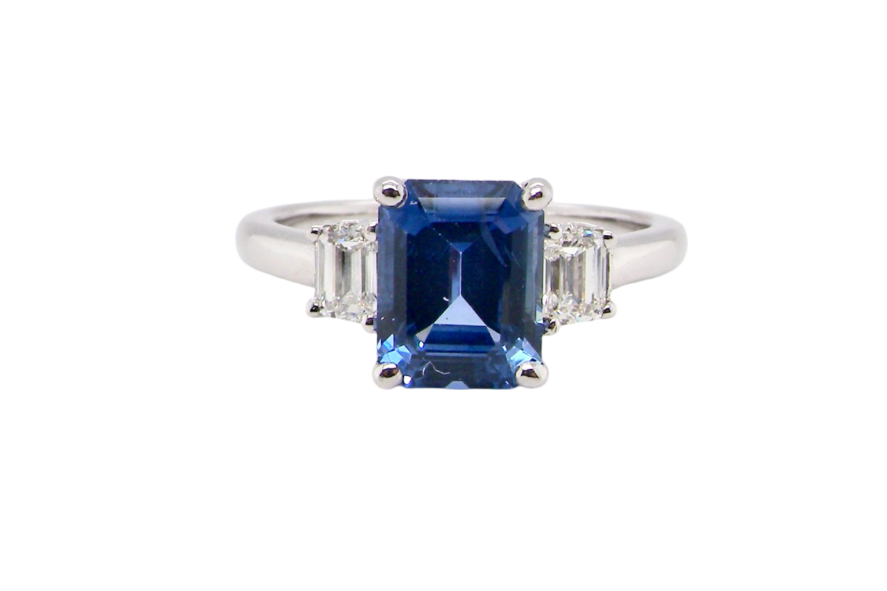 A fine three stone Sapphire and Diamond Ring