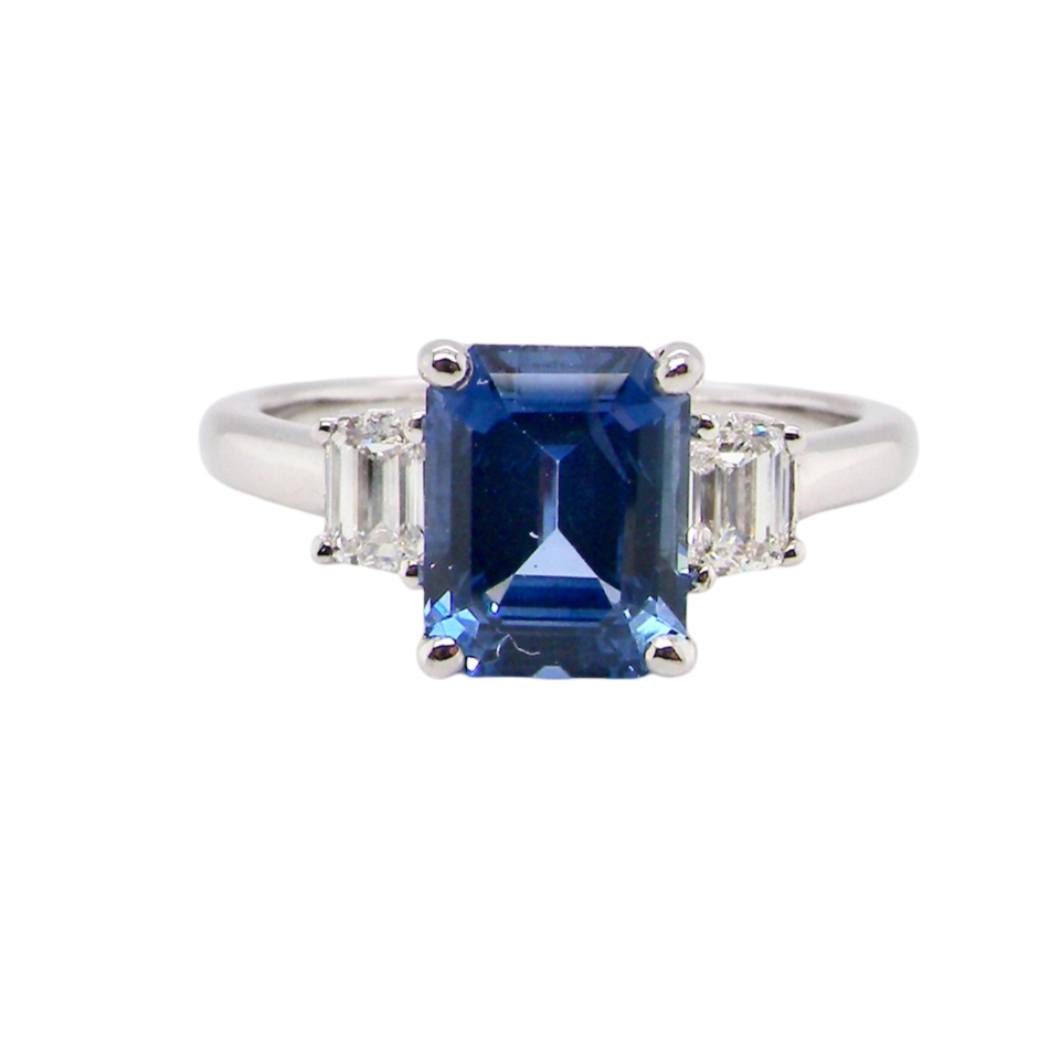 A fine three stone Sapphire and Diamond Ring