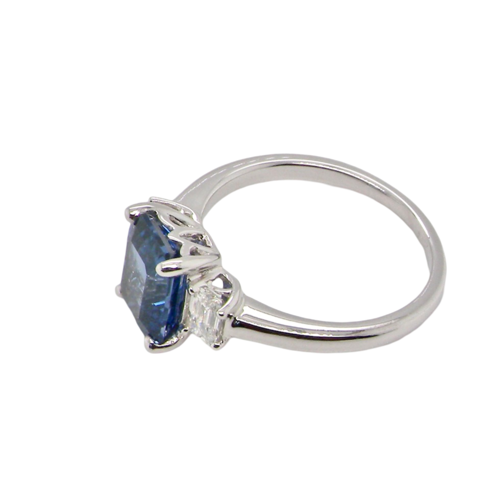 A fine three stone Sapphire and Diamond Ring side view