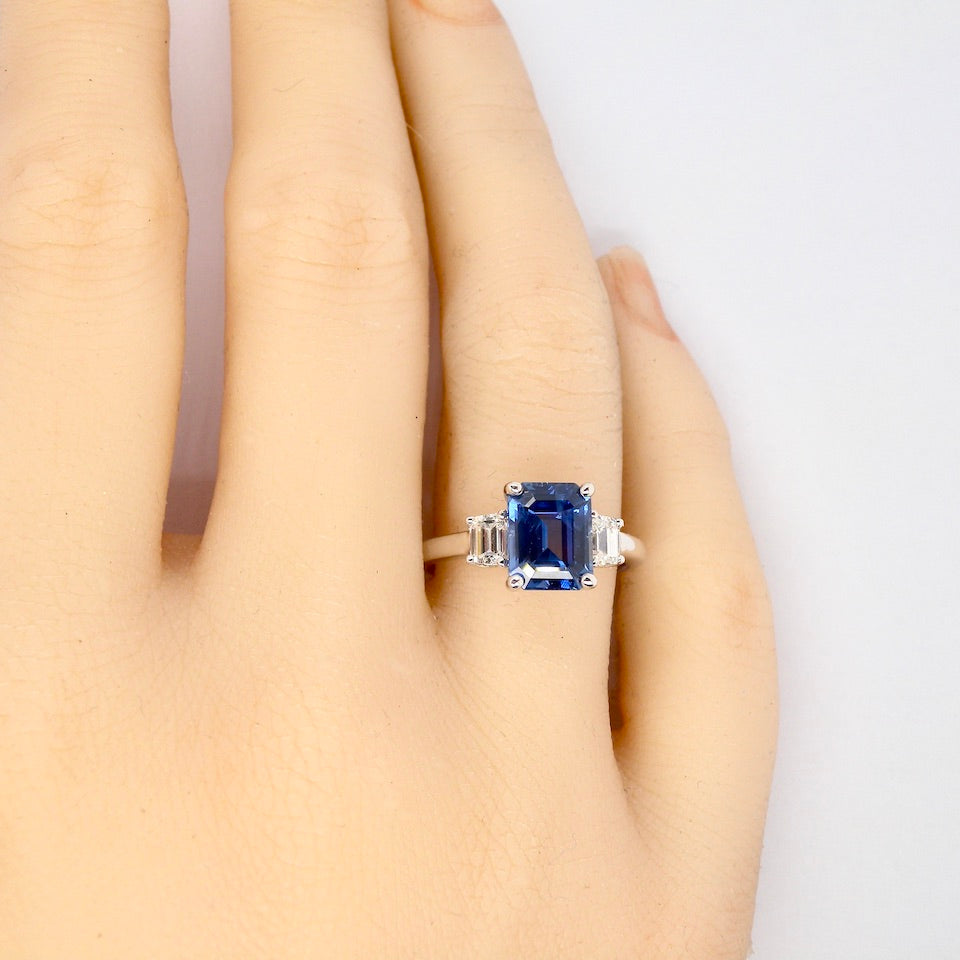 A fine three stone Sapphire and Diamond Ring finger view