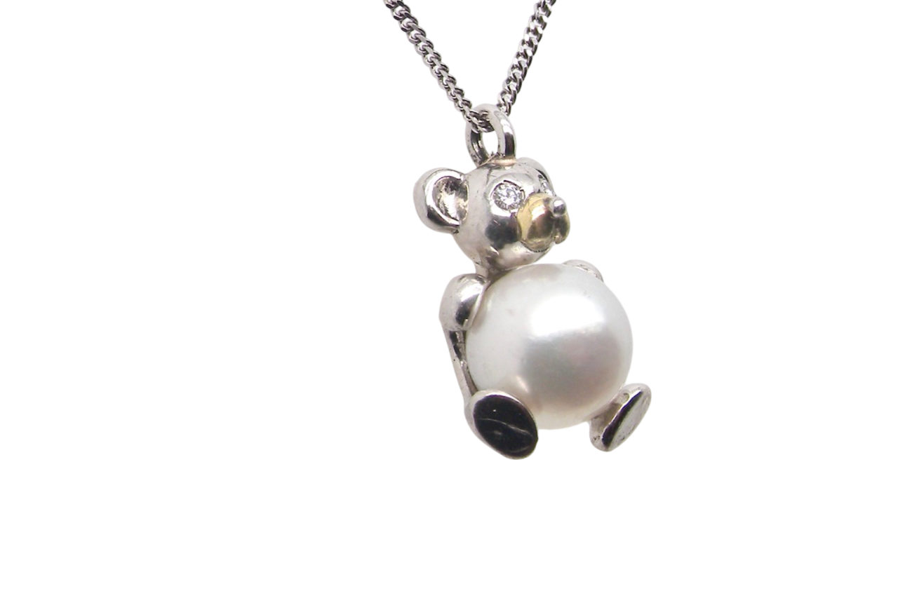 A Teddy Bear Pendant with diamonds