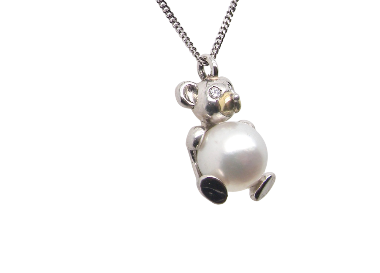 A Teddy Bear Pendant with diamonds