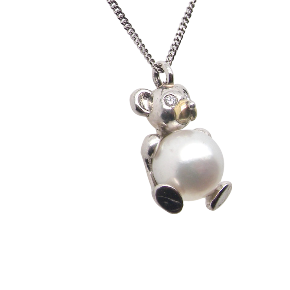 A Teddy Bear Pendant with diamonds