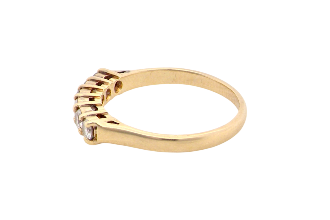 A half hoop diamond ring side view