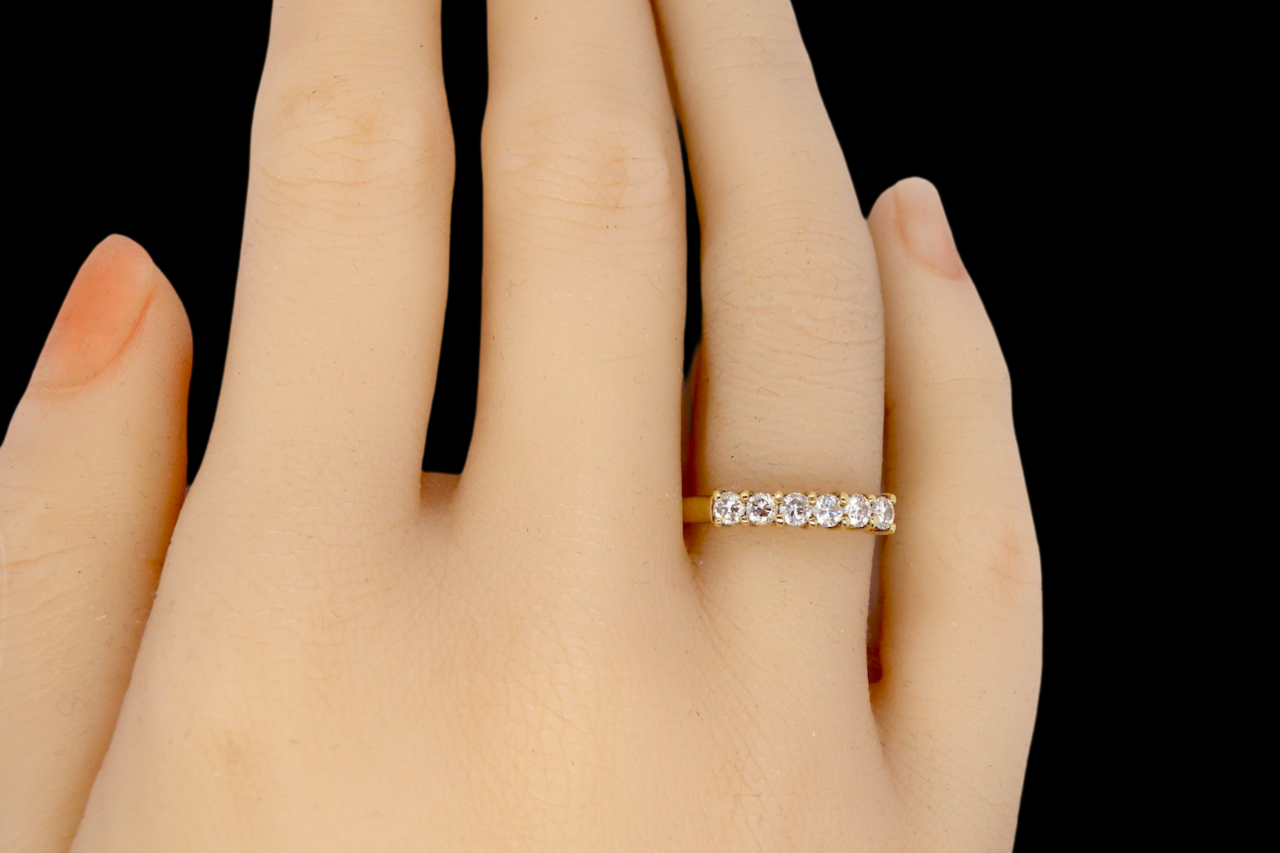 A half hoop diamond ring finger view