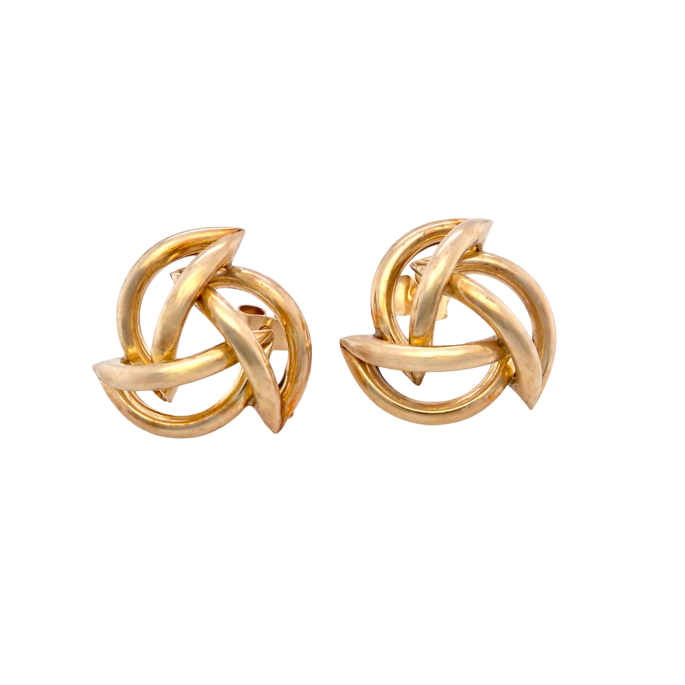 Pair of gold knot earrings on a white background