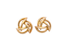 Pair of gold knot earrings on a white background