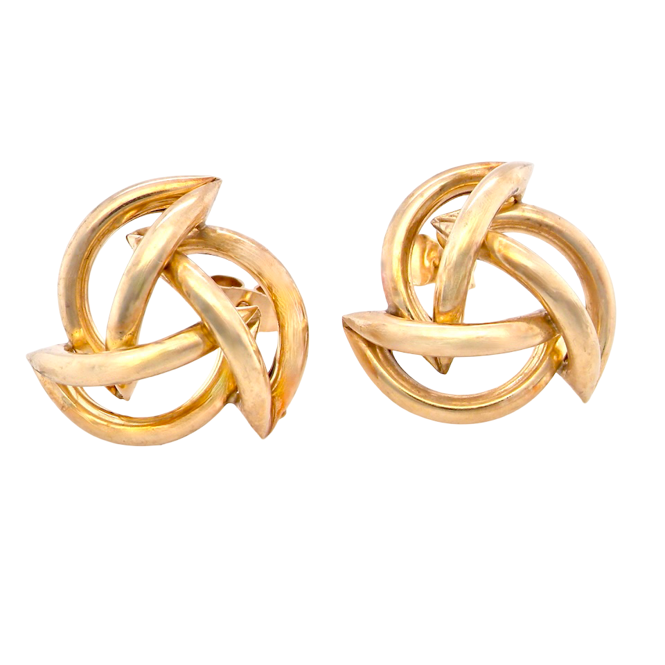 Pair of gold knot earrings on a white background