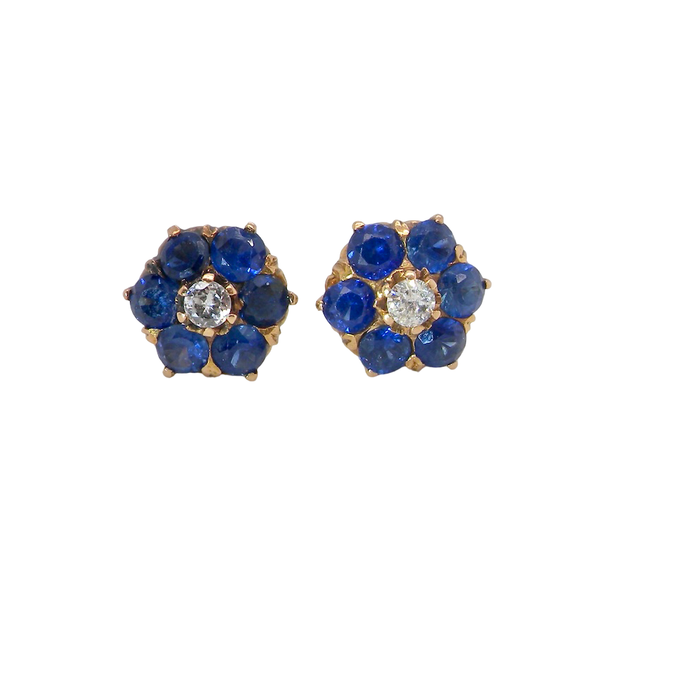 Pair of blue flower-shaped earrings with gold accents on a white background