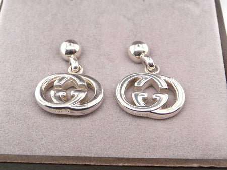 A pair of Silver Gucci earrings
