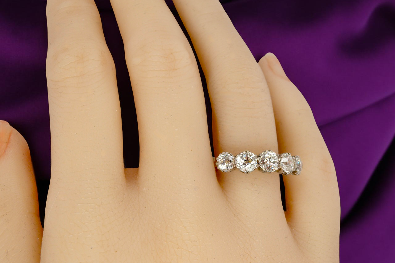 hand An impressive early 20th-century ring set with five old brilliant-cut white diamonds.